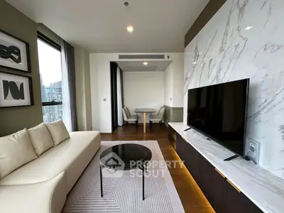 Modern living room with elegant marble wall and sleek TV setup