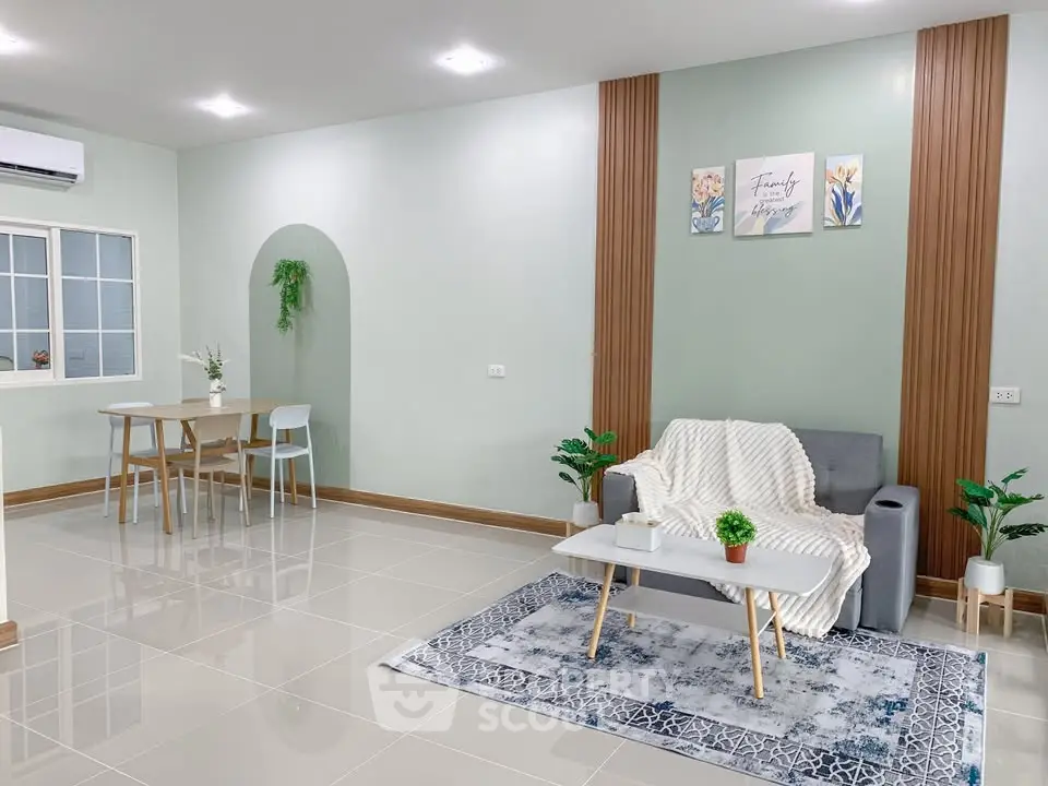 Modern living room with stylish decor and cozy seating area, perfect for relaxation and entertaining.