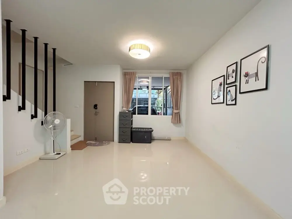 Spacious living room with modern decor and natural light