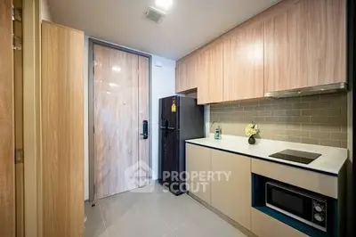 Modern kitchen with sleek cabinetry and built-in appliances