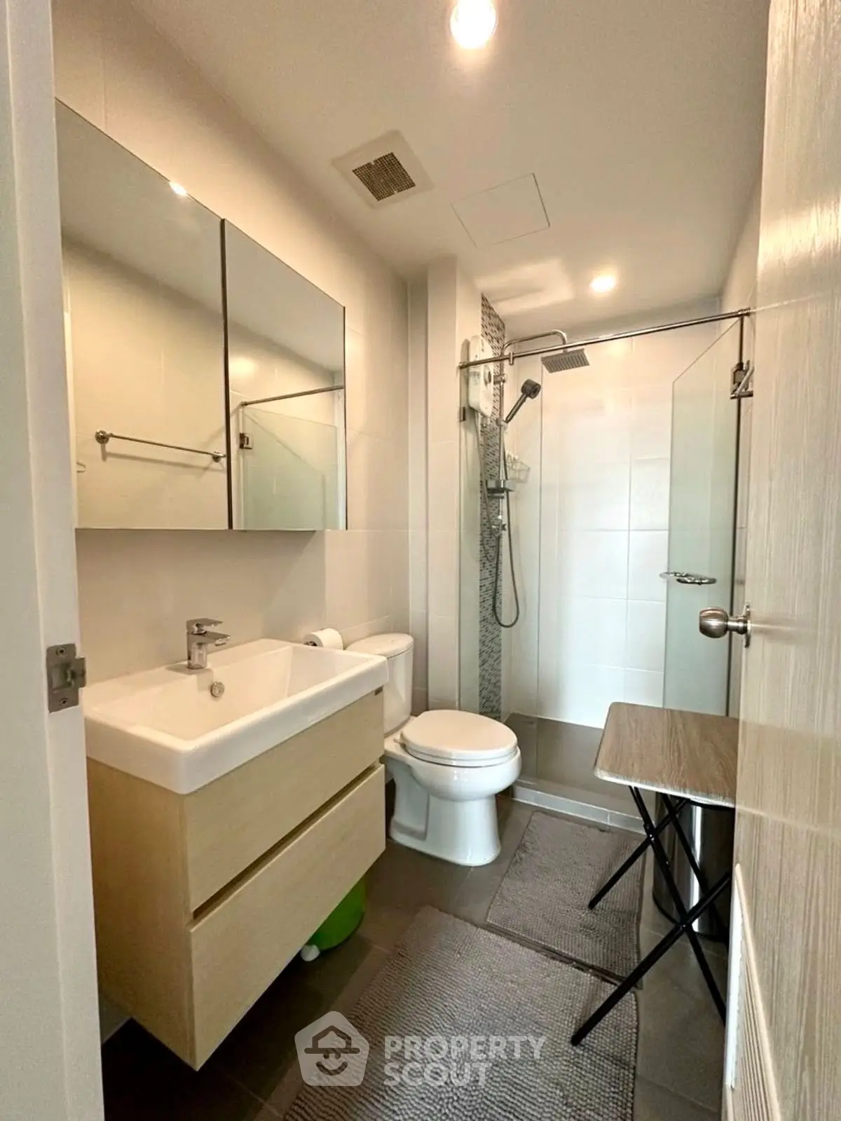 Modern bathroom with sleek fixtures and glass shower enclosure