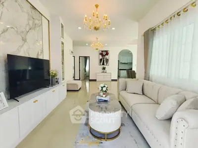 Luxurious living room with elegant chandeliers and modern decor