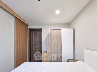 Modern bedroom with sleek wooden accents and minimalist design