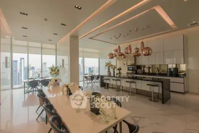 Luxurious modern kitchen with panoramic city views and elegant dining area.