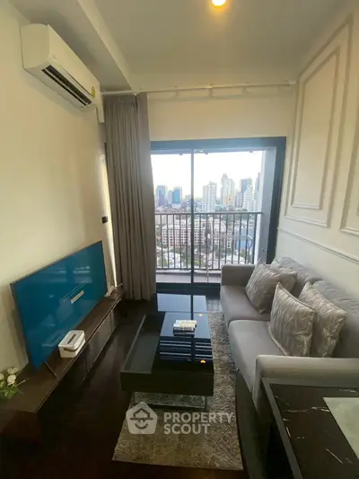 Modern living room with city view, featuring sleek furniture and large window balcony access.