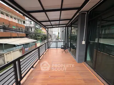 Spacious balcony with city view and modern design, perfect for relaxation or work-from-home setup.