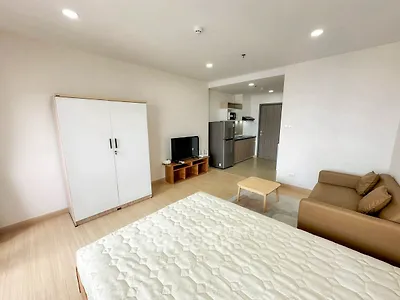 Spacious studio apartment with modern furnishings and open layout