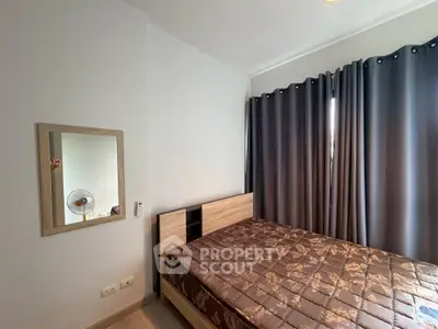 Cozy bedroom with modern decor and large window curtains