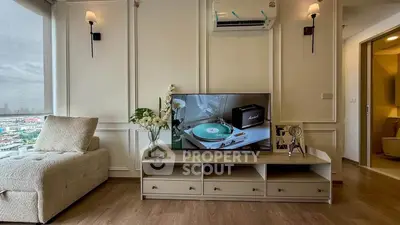 Stylish living room with modern decor and city view, featuring a cozy sofa and entertainment center.