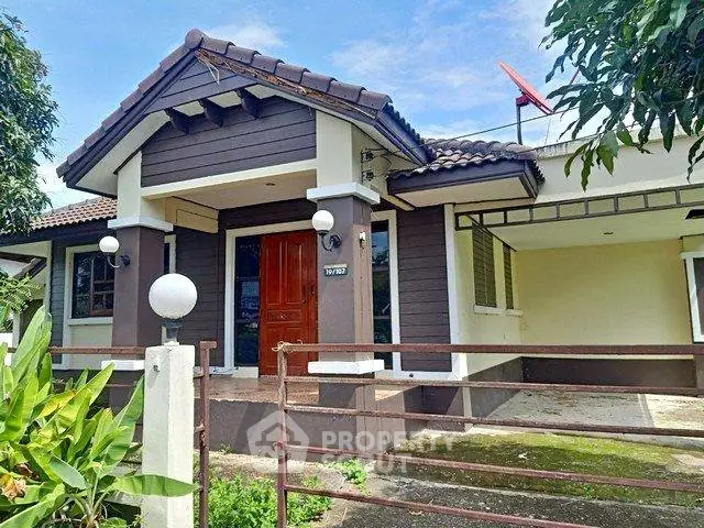 Charming suburban home with a tiled roof and lush greenery, perfect for family living.