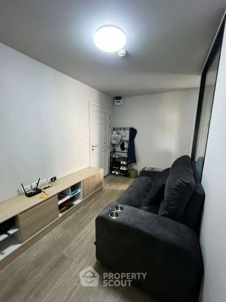 Cozy living room with modern sofa and sleek storage unit