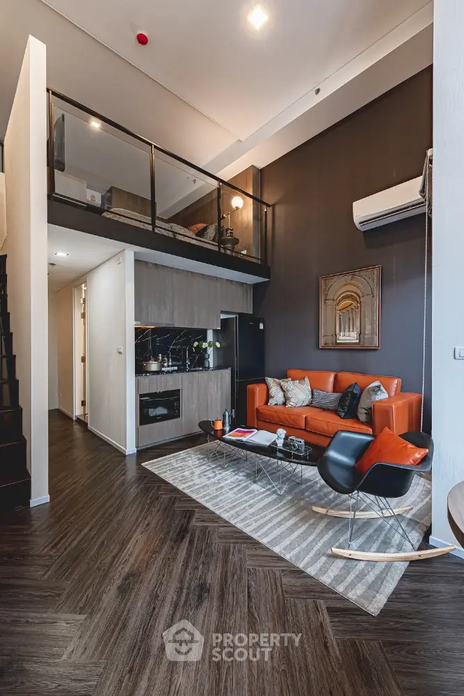Modern loft-style living room with high ceiling and stylish decor