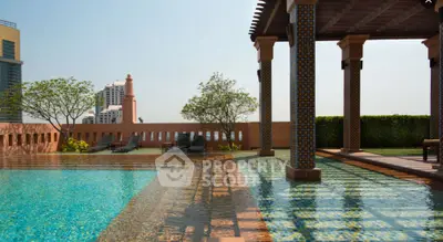 Luxurious rooftop pool with stunning city views and elegant architectural design.