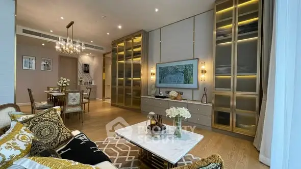 Luxurious living room with elegant decor and modern lighting in a stylish apartment.