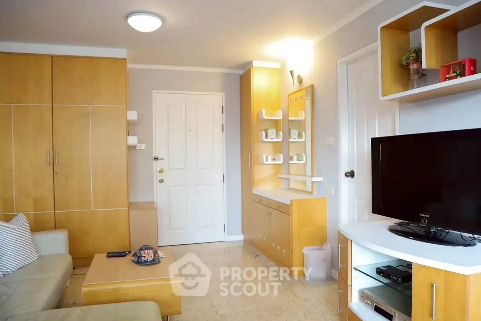 Modern living room with built-in wooden cabinets and sleek TV setup