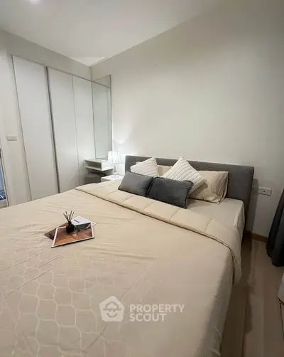 Cozy modern bedroom with stylish decor and ample storage space