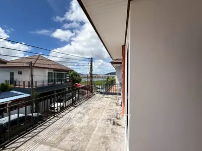 Spacious balcony with scenic view in a modern residential area, perfect for relaxation and outdoor enjoyment.