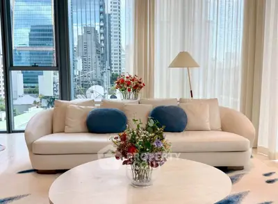 Luxurious living room with modern sofa and city view, perfect for urban living.