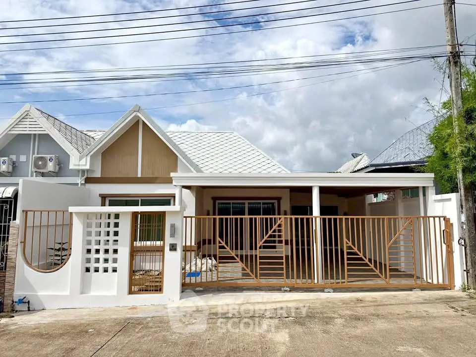 Charming single-story house with modern design and spacious driveway, perfect for family living.