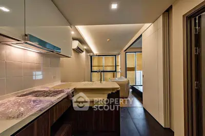 Modern kitchen with sleek design and open layout in a stylish apartment