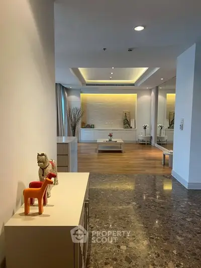 Spacious modern living room with elegant decor and marble flooring