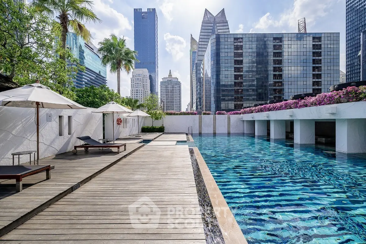 Luxurious rooftop pool with stunning city skyline views and modern amenities.