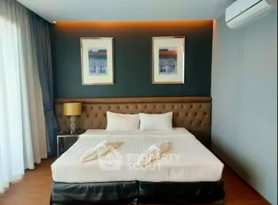 Luxurious bedroom with elegant decor and large bed, perfect for relaxation.