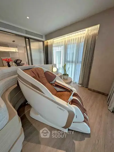 Luxurious modern living room with massage chair and elegant decor
