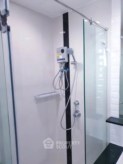 Modern bathroom with sleek shower design and glass partition