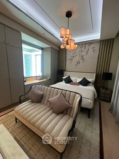 Luxurious bedroom with elegant decor and modern lighting in a high-end apartment.
