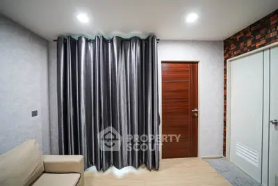 Modern living room with stylish curtains and wooden door