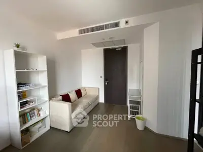 Modern living room with sleek design and cozy sofa, perfect for relaxation and entertainment.