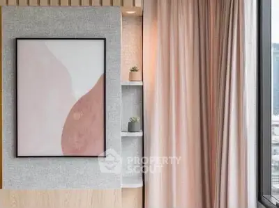 Modern interior with stylish wall art and elegant curtains in a cozy living space.