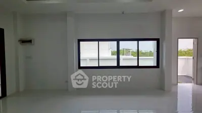 Spacious modern interior with large window and open layout, perfect for customization.