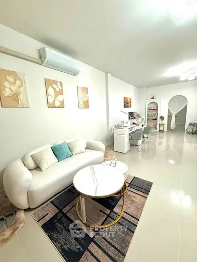 Spacious living room with modern decor and elegant furniture, perfect for relaxation and entertainment.