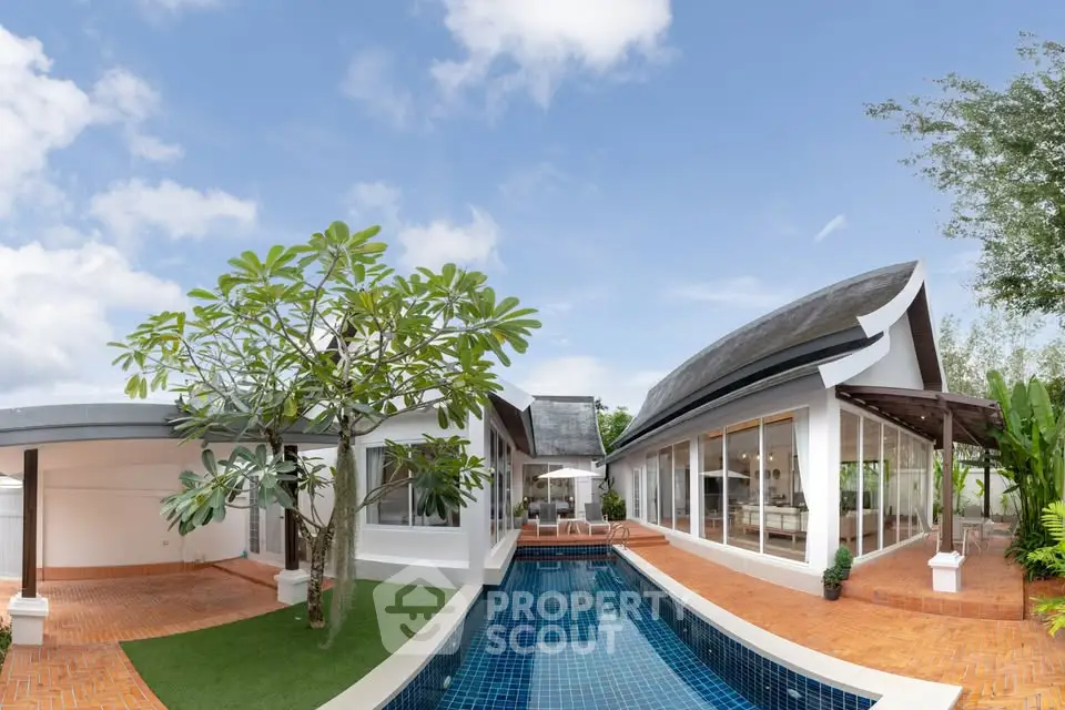 Luxurious modern villa with private pool and lush garden, perfect for serene living.