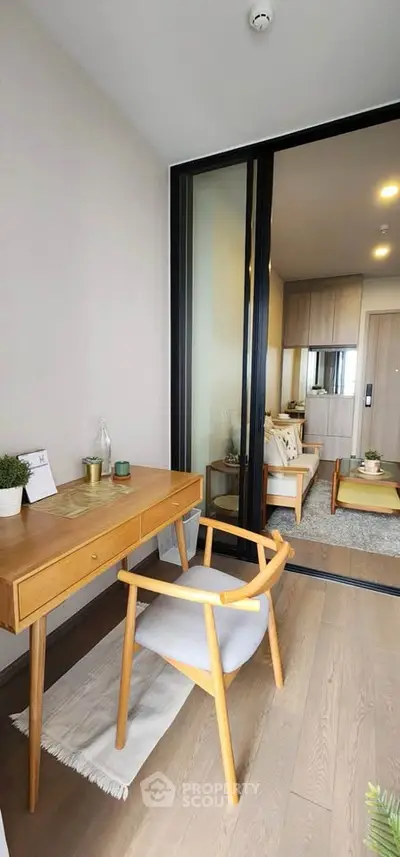 Modern apartment interior with stylish furniture and open layout, featuring a cozy living area and study nook.