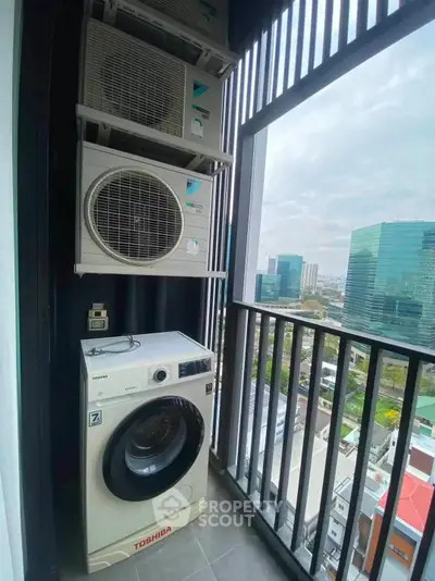 Modern balcony with washing machine and city view, perfect for urban living convenience.