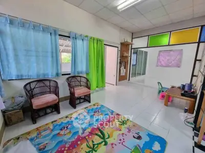 Bright and colorful living room with playful decor and ample natural light.