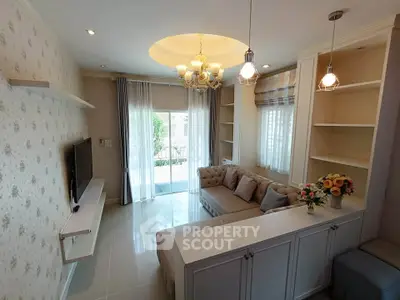 Elegant living room with modern chandelier and cozy sectional sofa