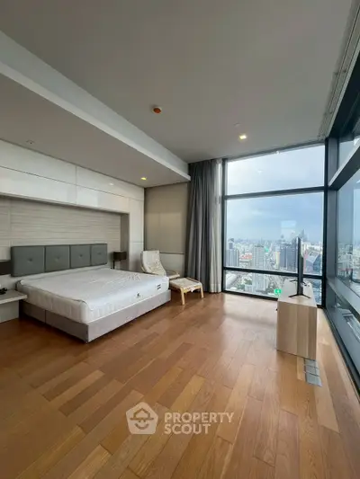 Luxurious bedroom with stunning city view and modern furnishings