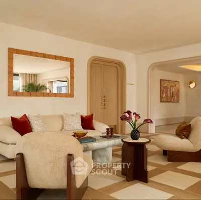 Luxurious living room with elegant decor and plush seating in a modern apartment.