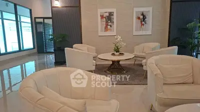 Elegant modern living room with plush seating and stylish decor in a luxurious setting.