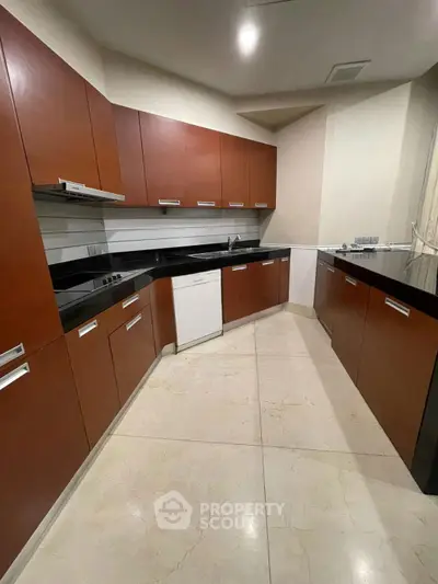 Modern kitchen with sleek cabinetry and spacious layout, perfect for culinary enthusiasts.