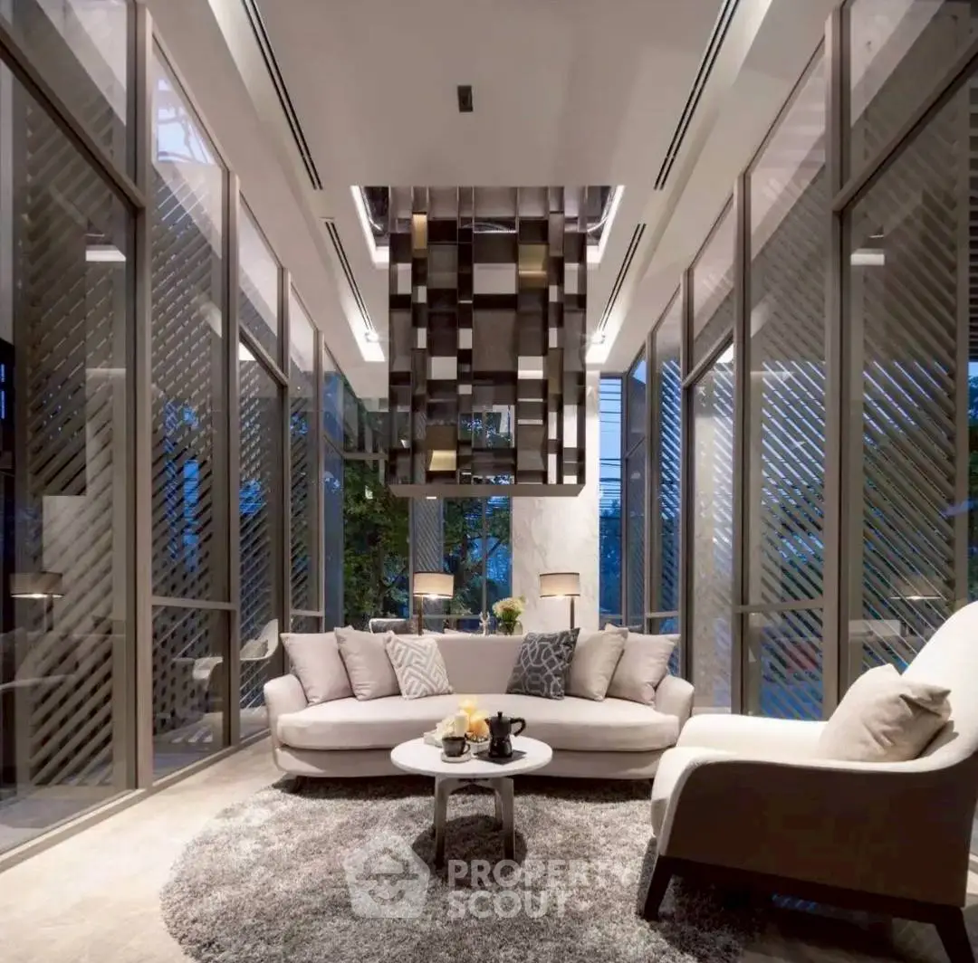 Luxurious modern living room with high ceilings and large windows offering stunning views.