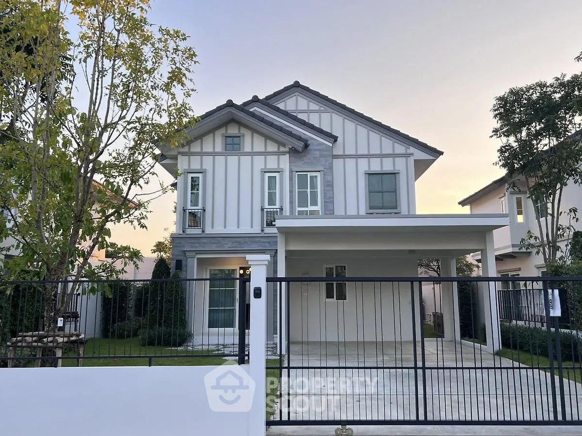 Charming two-story house with modern design and spacious driveway