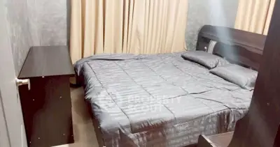 Cozy bedroom with modern decor and elegant curtains