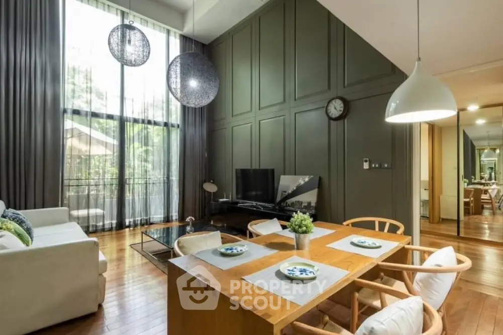 Luxurious modern living room with high ceilings and elegant decor
