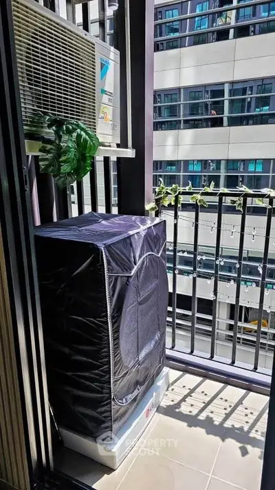 Modern balcony with air conditioning unit and city view, perfect for urban living.