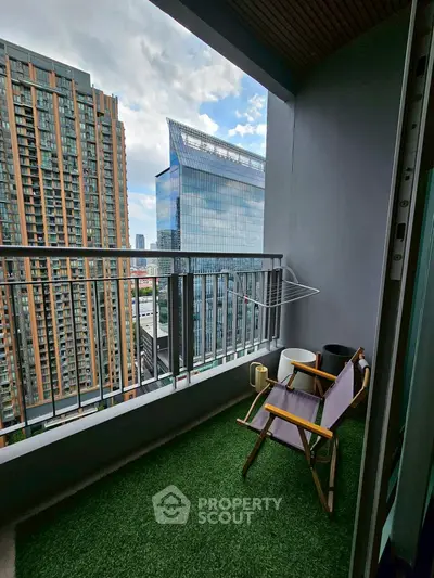 Chic urban balcony with artificial grass and stunning cityscape view